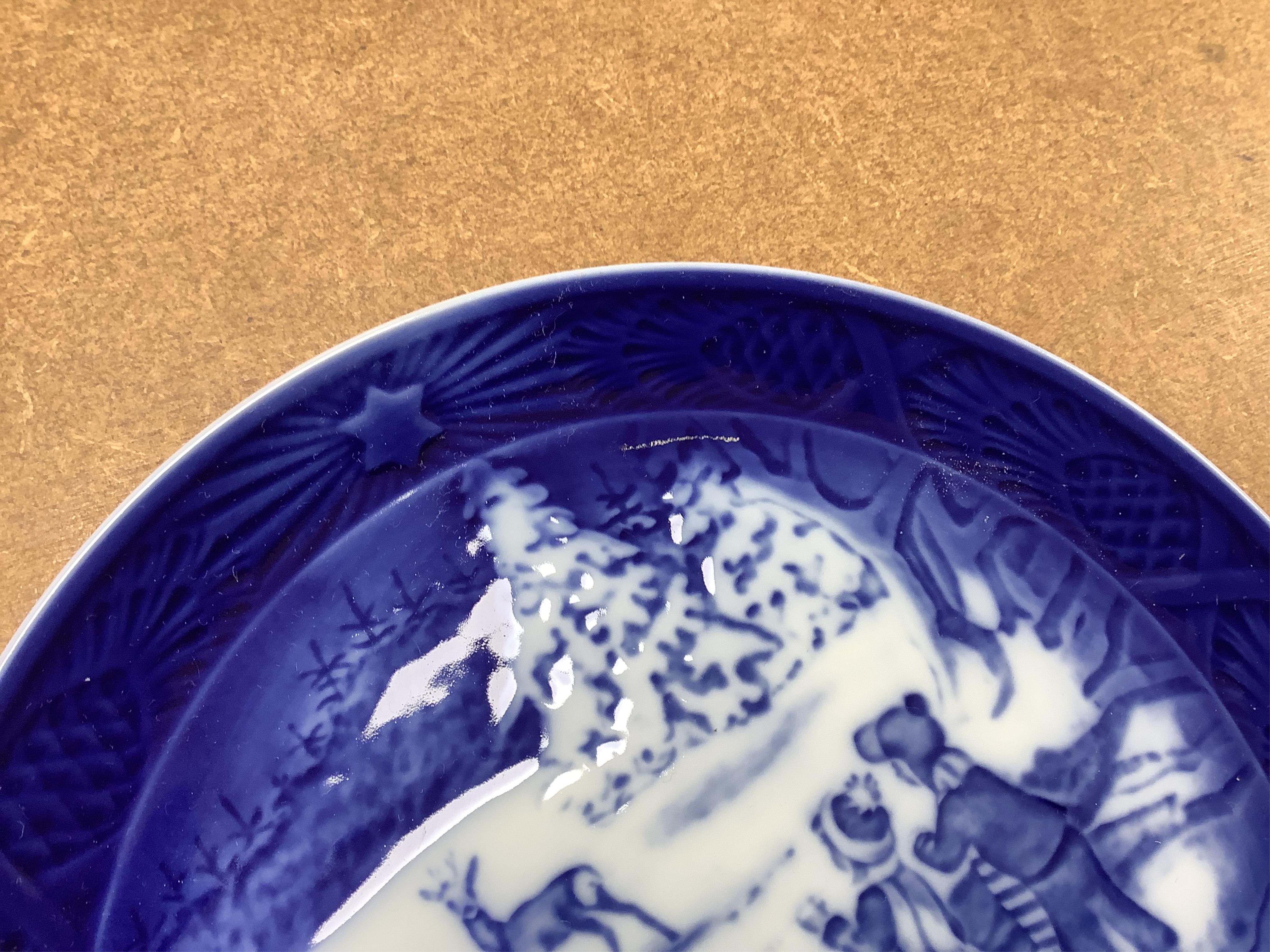 A large collection of Royal Copenhagen Christmas plates to include In the old farmyard, 1969 and In the desert 1972, with three boxes, each 18cm in diameter. Condition - good